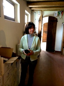 Vittoria Bonotto, wife of winemaker Antonio Bonotto, selects a bottle of Bonotto delle Tezze Raboso del Piave Potestá for a guest. 